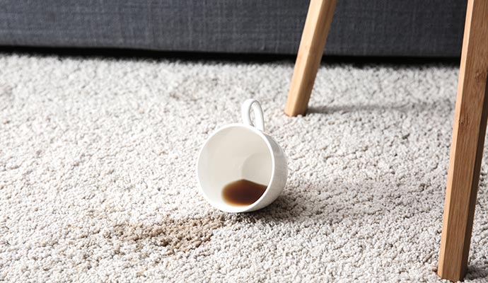 a carpet stained by spilling coffee
