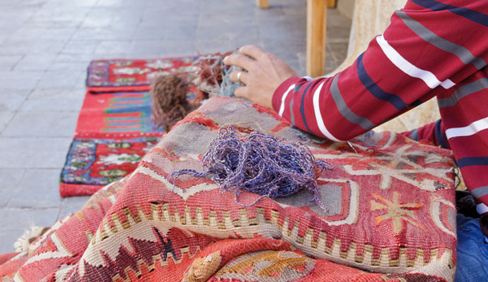Rug backing repair service